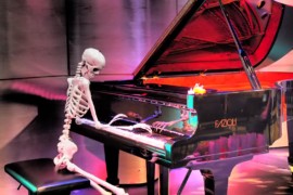 Photo of skeleton playing piano
